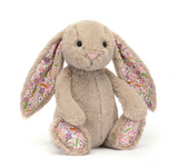 Plush bunny toy with floral ears on a white background