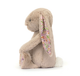 Plush bunny toy with a floral scarf on a white background