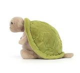 Plush turtle toy with green shell on a white background