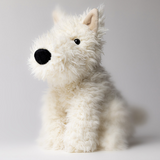 White plush dog toy on a light gray background