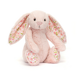 Floral-patterned plush bunny toy on a white background