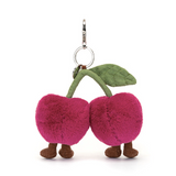 Plush cherry keychain with legs and a green stem on a white background