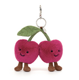 Plush cherry keychain with a leaf on a white background
