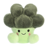 Plush toy shaped like a broccoli with a smiling face on a white background
