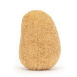 Round, beige-colored object on a white background