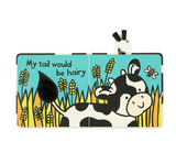 Children's book with a cow illustration and text on a white background