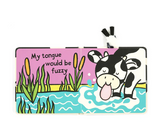 Children's book with a cow illustration and text on a white background