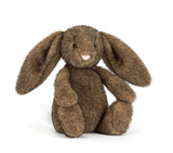 Brown plush bunny toy on a white background