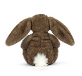 Brown plush bunny toy on a white background