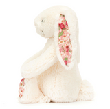 Floral-patterned plush bunny toy on a white background
