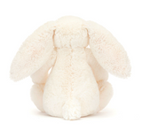 White plush bunny toy on a white background