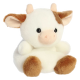 Plush cow toy with brown and white fur on a white background