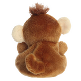 Back view of a plush monkey toy on a white background