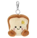 Plush keychain shaped like a slice of bread with a smiley face on a white background