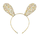 Floral-patterned bunny ears headband on a white background