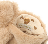 Close-up of a plush toy with a 'Rockahula' label on a white background