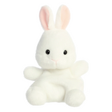 White plush bunny toy with pink ears on a white background