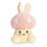 Plush toy with a pink mushroom cap and yellow body on a white background