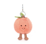 Plush peach character keychain on a white background