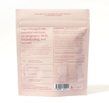 Back of a pink package with text and nutritional information on a white background