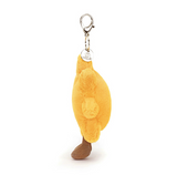 Yellow plush keychain with a brown base on a white background