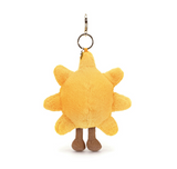 Yellow plush sun-shaped keychain on a white background