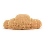 Plush toy shaped like a croissant on a white background