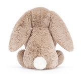 Plush bunny toy with a white paw on a white background
