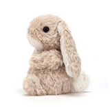 Plush bunny toy with beige and brown fur on a white background