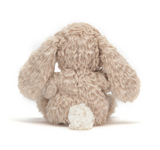 Plush bunny toy on a white background