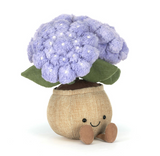 Plush toy resembling a cauliflower with a smiling face on a white background