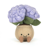 Plush toy with purple flowers and a smiling face on a white background