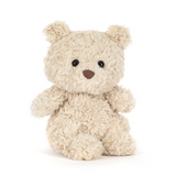 Small beige teddy bear on a white background