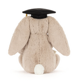 Plush bunny toy wearing a graduation cap on a white background