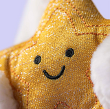 Gold star-shaped plush toy with a smiley face on a white background