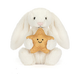 White plush bunny holding a star-shaped toy with a smiley face on a white background