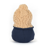 Small plush toy with a beige knitted hat and navy body on a white background