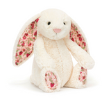 Floral-patterned bunny plush toy on a white background