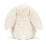 White plush bunny toy on a white background