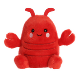 Red plush toy with a happy expression on a white background