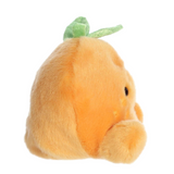 Plush toy shaped like a peach with a green stem on a white background