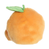 Plush toy shaped like a peach with a green leaf on a white background