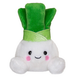 Plush toy shaped like a turnip with a green leaf on a white background