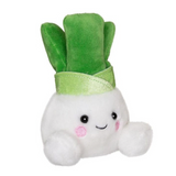 Plush toy shaped like a turnip with a smiling face on a white background