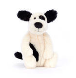 Stuffed animal toy with black and white pattern on a white background
