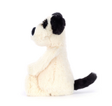 White plush toy with black accents on a white background