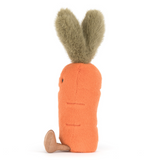 Stuffed toy carrot with bunny ears on a white background