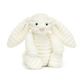 White plush bunny toy on a white background