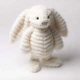 White plush bunny toy on a light gray background