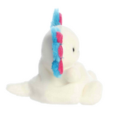 Plush toy seal with a colorful feather on a white background